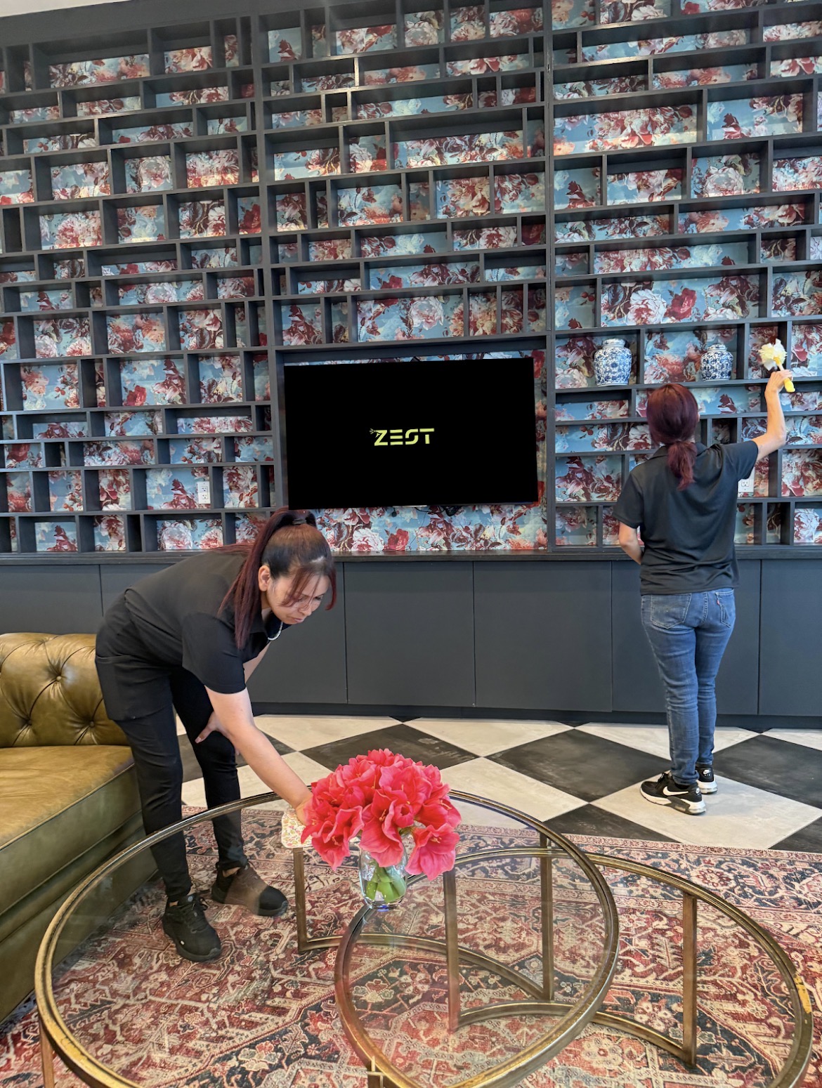 The Zest team dusting and detailing an Austin living room
