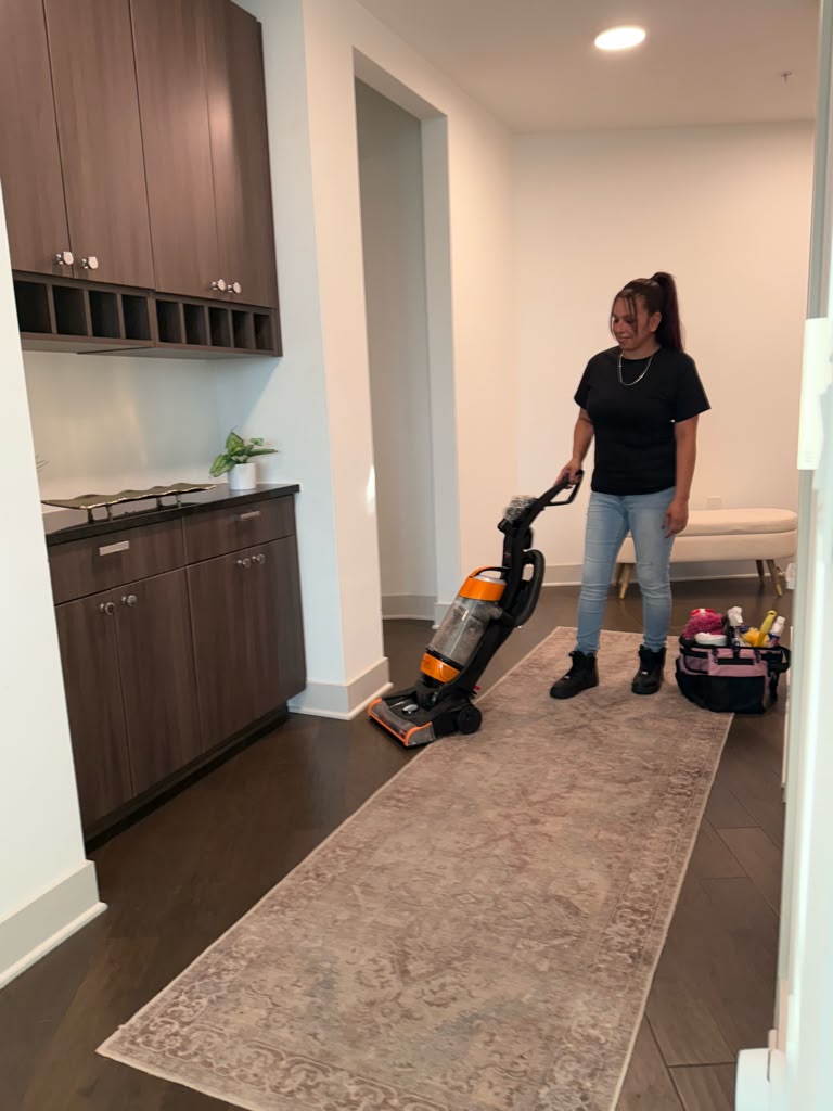 Zest cleaner vacuuming a home